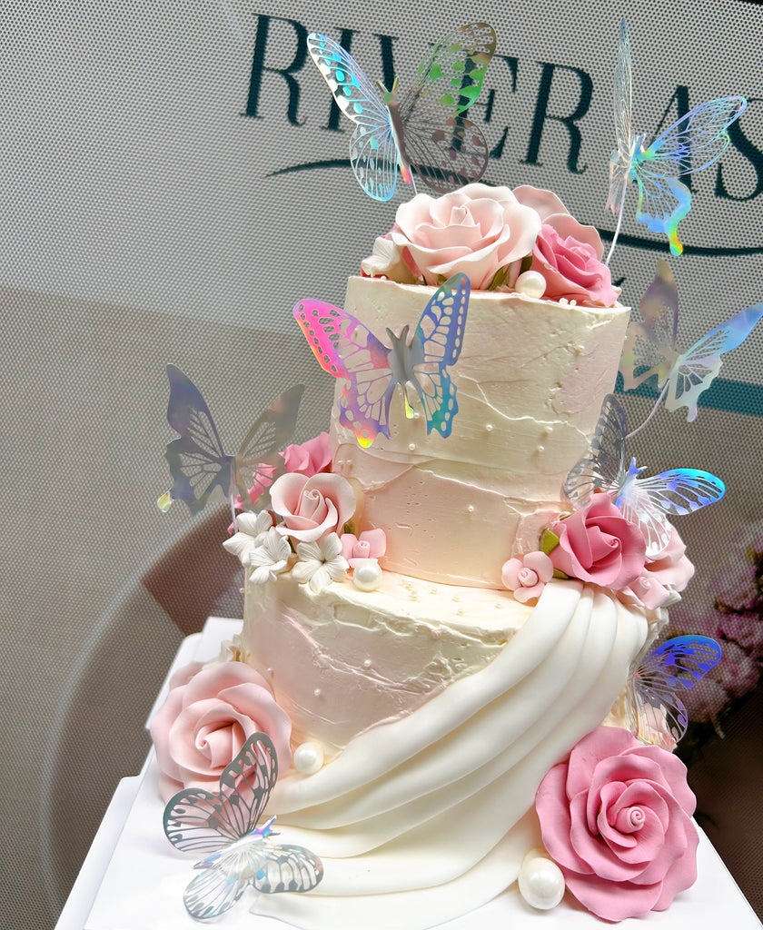 Fondant pink flowers and butterflies cake