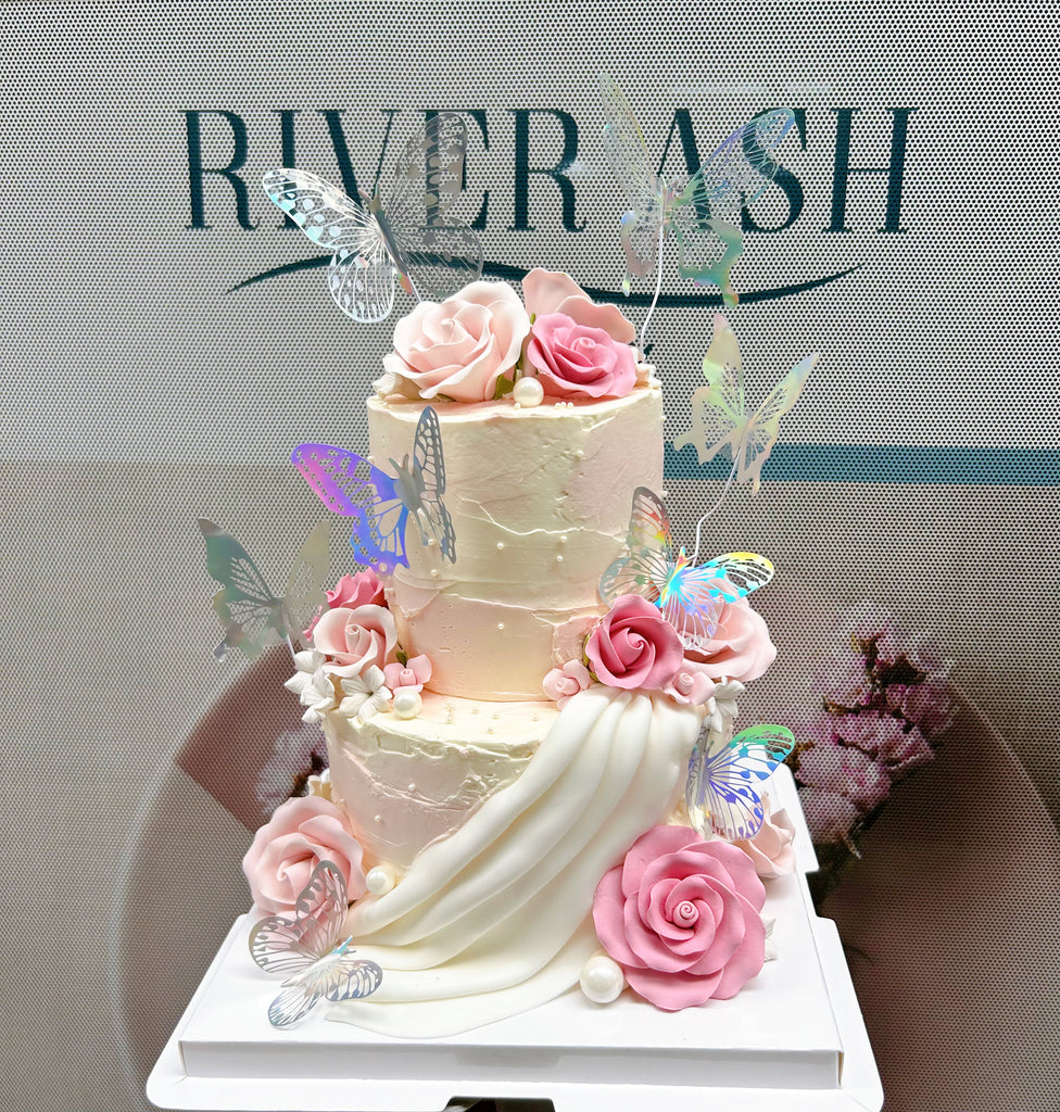 Fondant pink flowers and butterflies cake