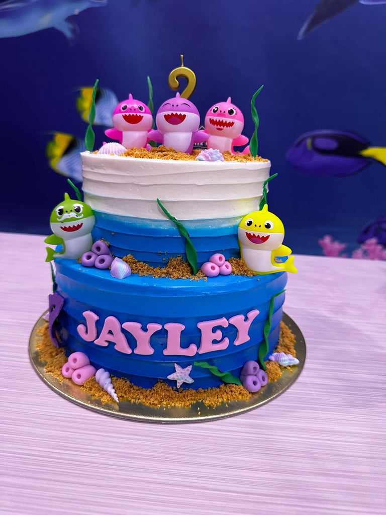 Premium Photo | Baby shark themed small cake buttercream and toys  photography set cake smash set decoration